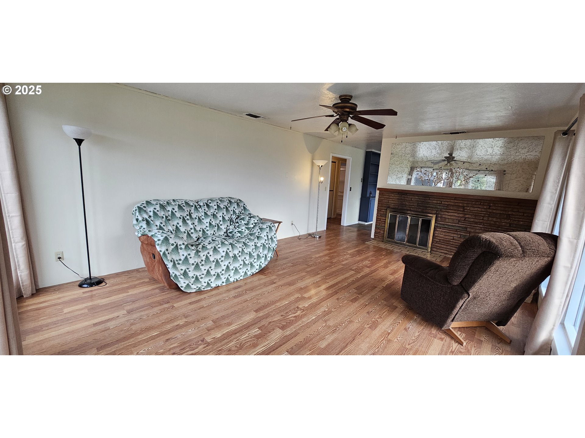 29545 Bailor Street Gold Beach, OR 97444 - Photo 13 of 48 a living room with furniture and a wooden floor