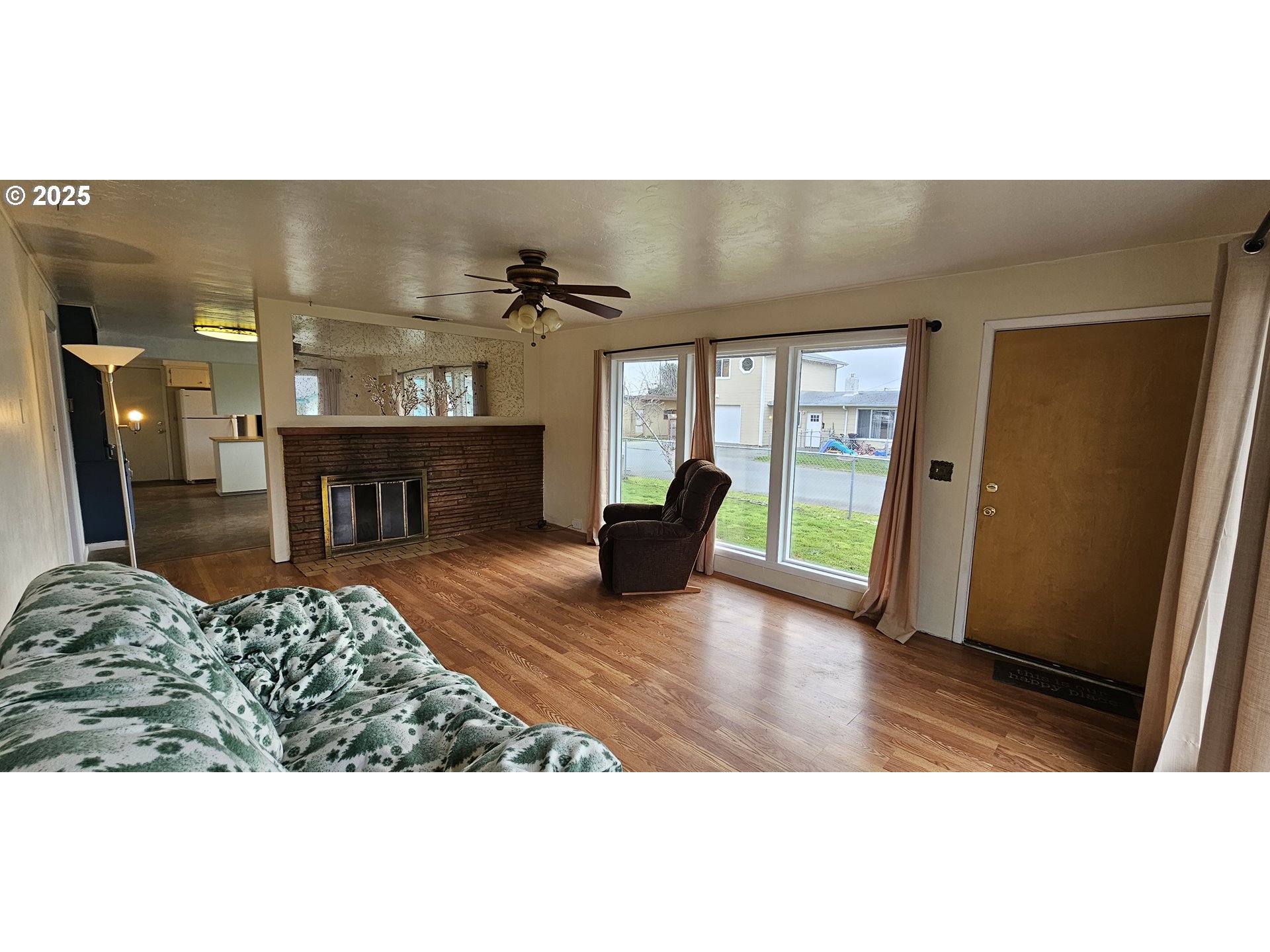 29545 Bailor Street Gold Beach, OR 97444 - Photo 14 of 48 a living room with furniture and a fireplace