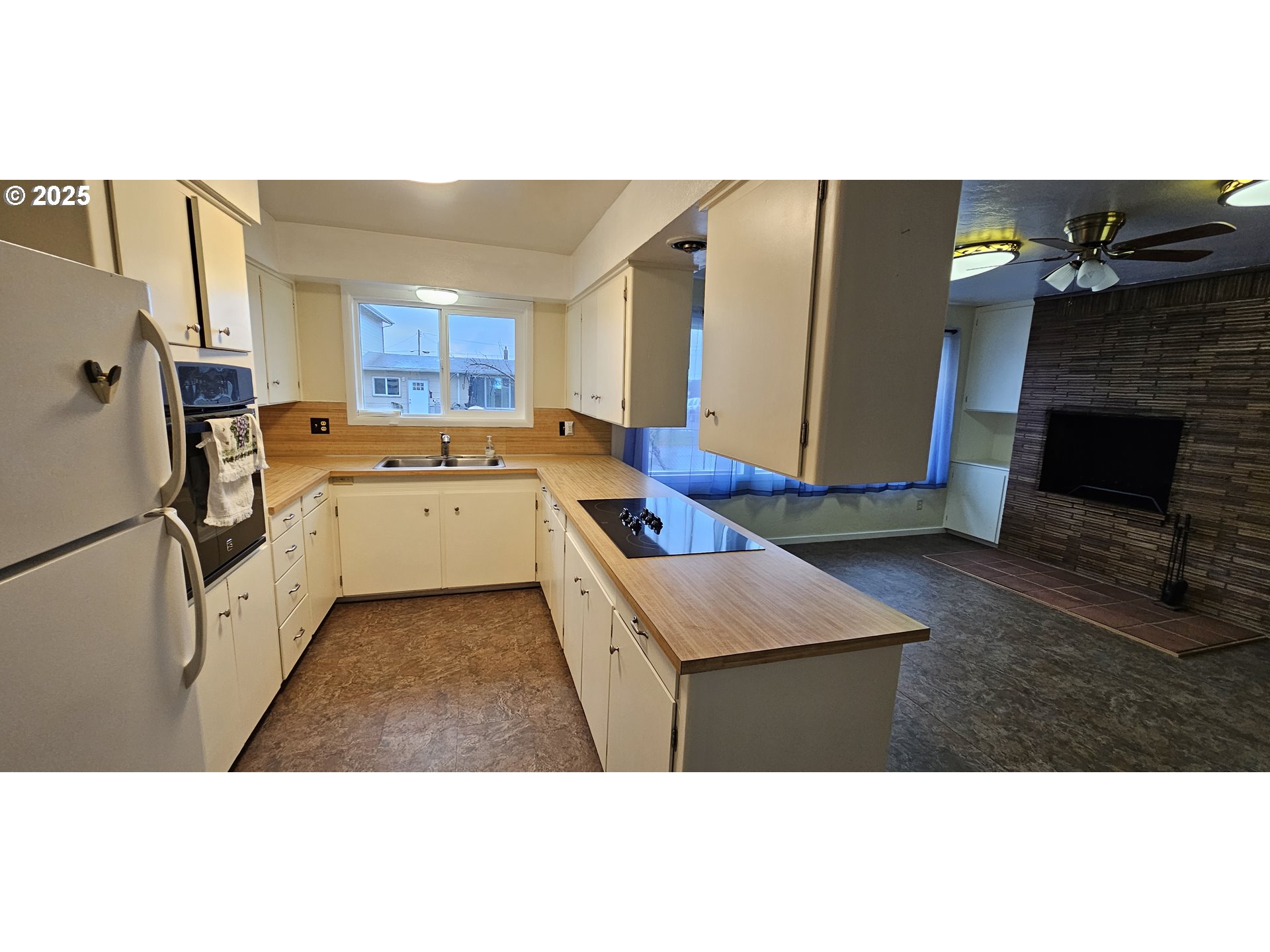 29545 Bailor Street Gold Beach, OR 97444 - Photo 17 of 48 a open kitchen with a refrigerator a stove top oven a sink and dishwasher