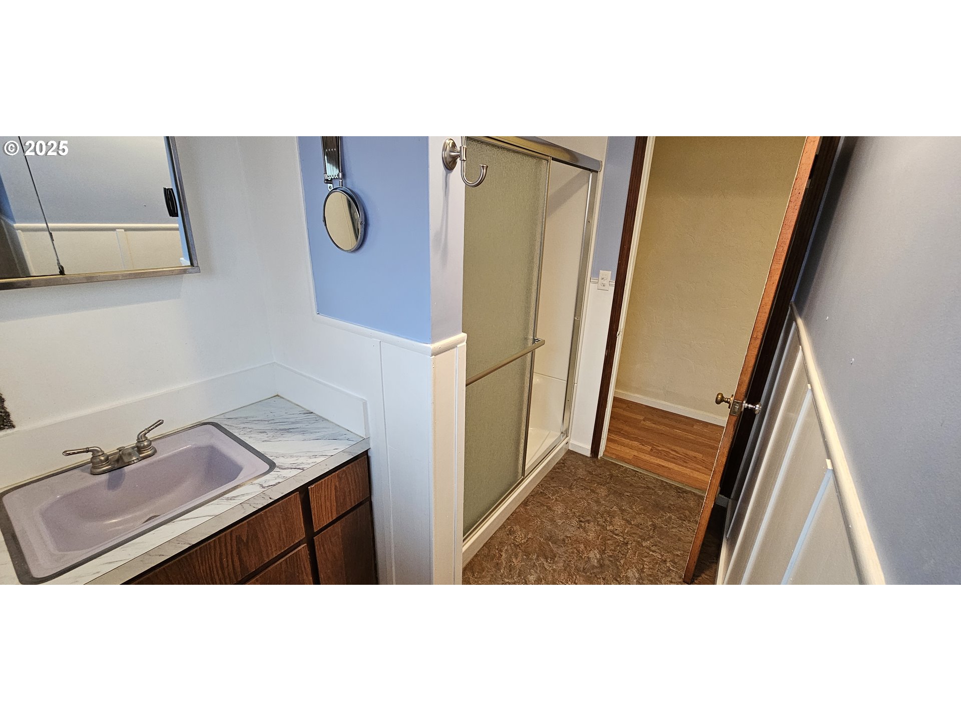 29545 Bailor Street Gold Beach, OR 97444 - Photo 34 of 48 a bathroom with a sink a mirror and shower