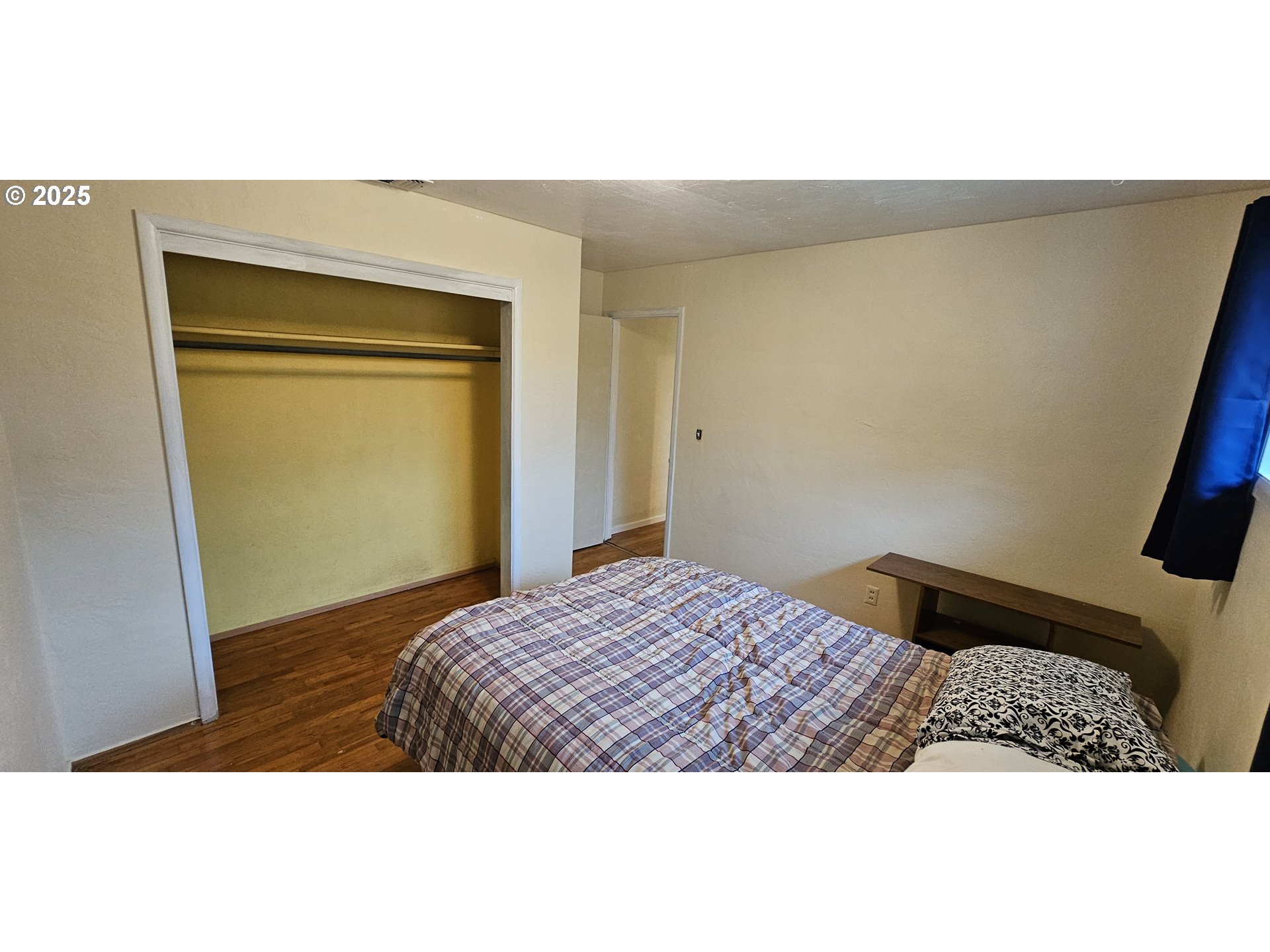 29545 Bailor Street Gold Beach, OR 97444 - Photo 36 of 48 a bedroom with a bed and wooden floor