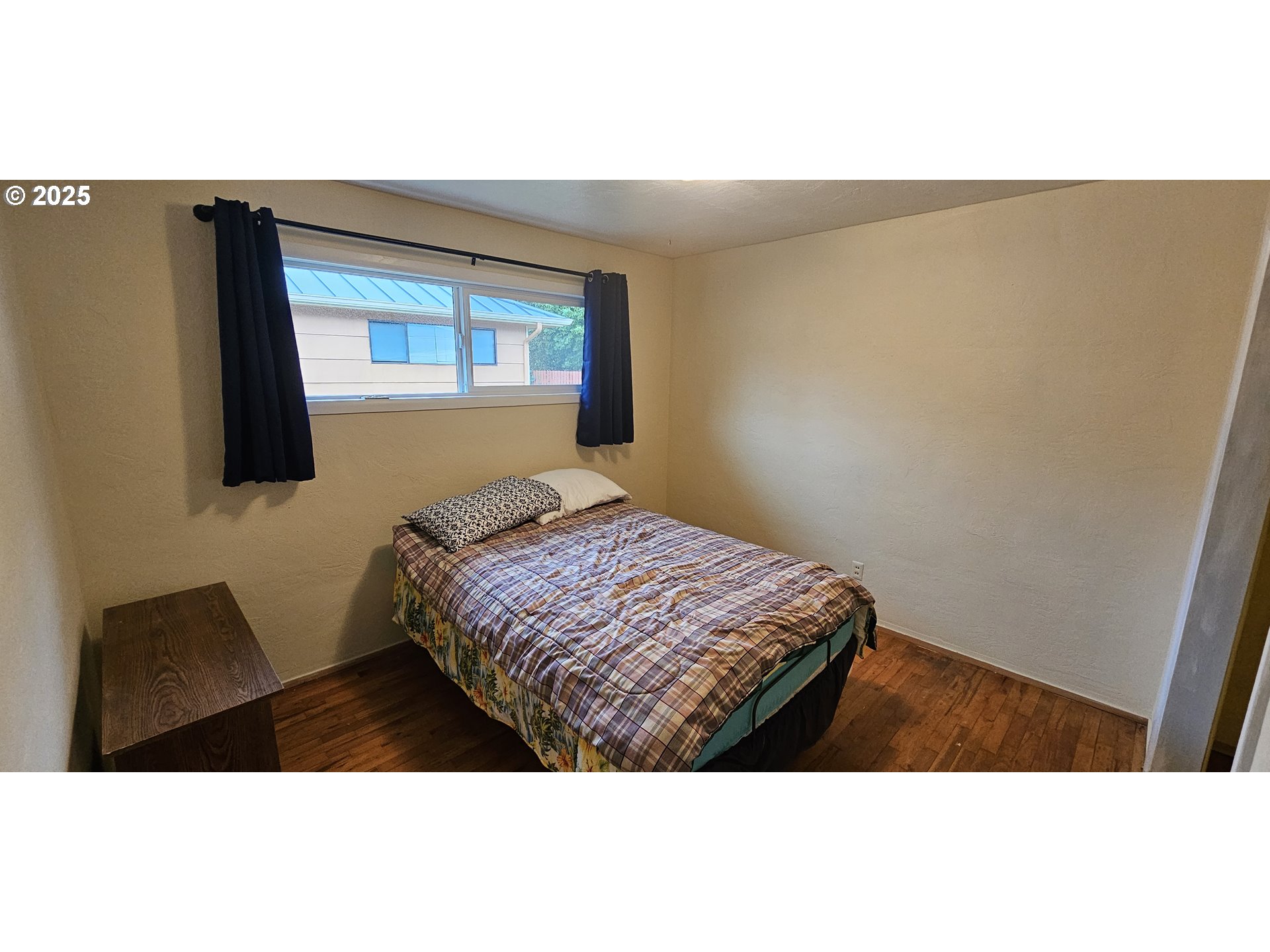 29545 Bailor Street Gold Beach, OR 97444 - Photo 38 of 48 a bedroom with a bed and a window