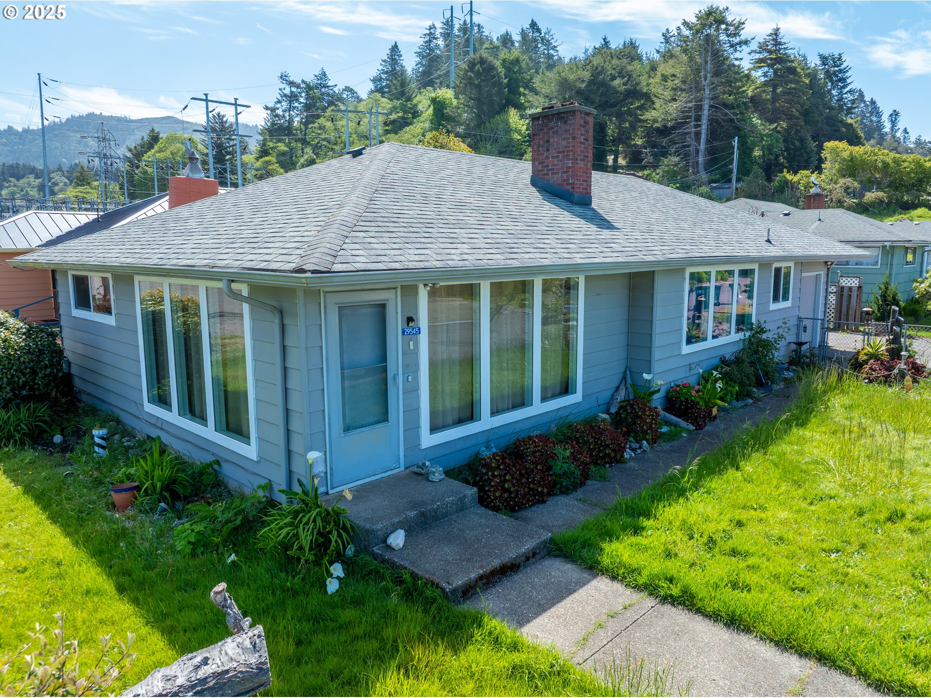 29545 Bailor Street Gold Beach, OR 97444 - Photo 46 of 48 a house view with a garden space