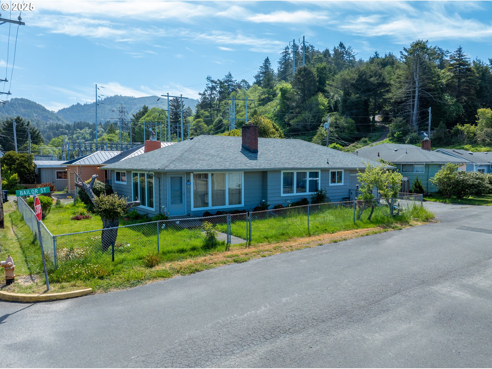 29545 Bailor Street Gold Beach, OR 97444 - Photo 47 of 48 a front view of house with a yard and potted plants