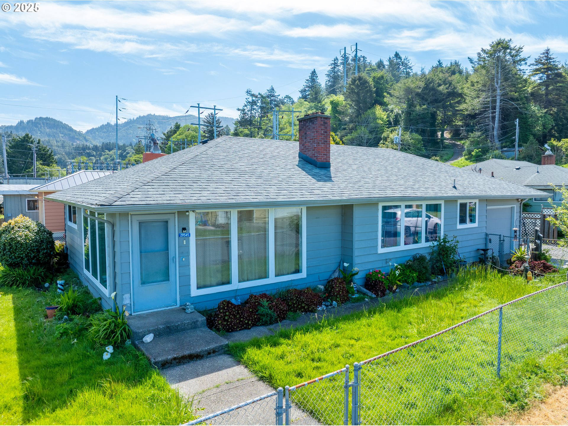 29545 Bailor Street Gold Beach, OR 97444 - Photo 48 of 48 a house view with a garden space
