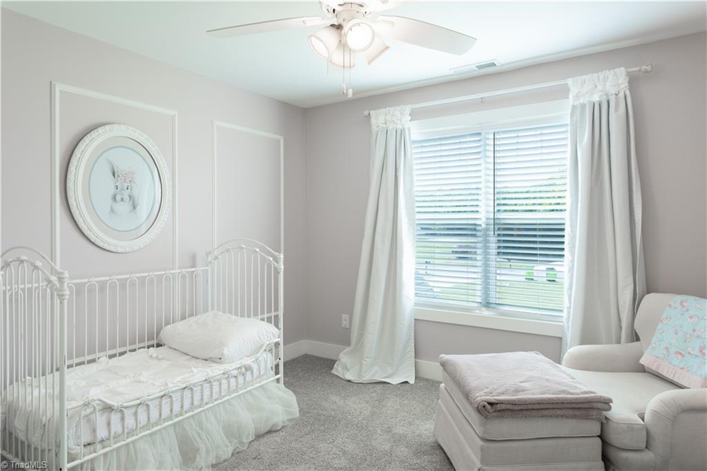393 Scout Road Lexington, NC 27292 - Photo 38 of 47 Bedroom #3 faces the front of the home. Picture worthy and serene.
