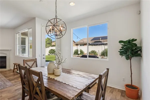 a large kitchen with lots of counter space a sink appliances and a dining table