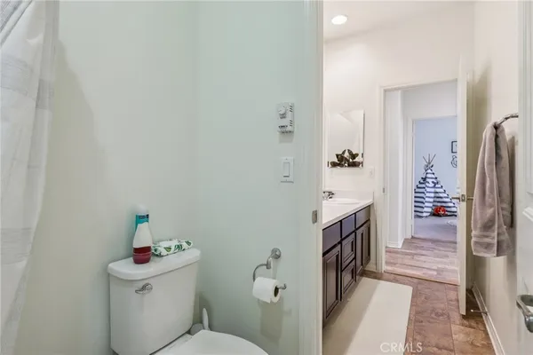 a bedroom with a bed and a view of bedroom