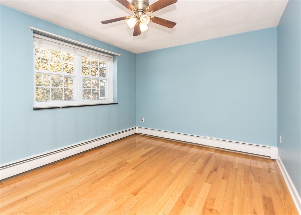 99 Pleasant Street, Unit 11 Watertown, MA 02472 - Photo 12 of 22 a view of an empty room with a window
