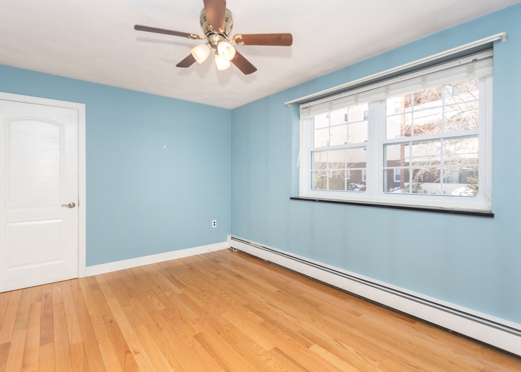 99 Pleasant Street, Unit 11 Watertown, MA 02472 - Photo 13 of 22 a view of empty room with window