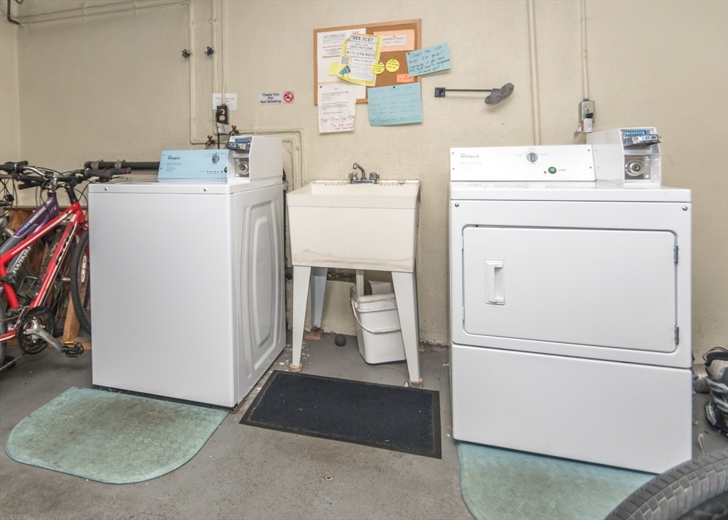 99 Pleasant Street, Unit 11 Watertown, MA 02472 - Photo 18 of 22 a utility room with dryer and washer