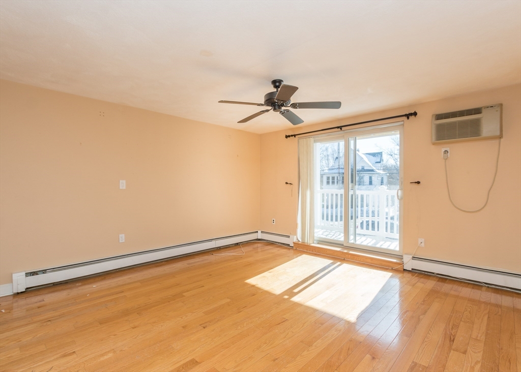 99 Pleasant Street, Unit 11 Watertown, MA 02472 - Photo 5 of 22 a view of an empty room with a window