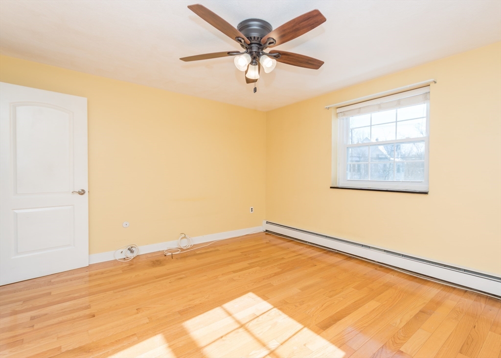 99 Pleasant Street, Unit 11 Watertown, MA 02472 - Photo 10 of 22 a view of an empty room with a window