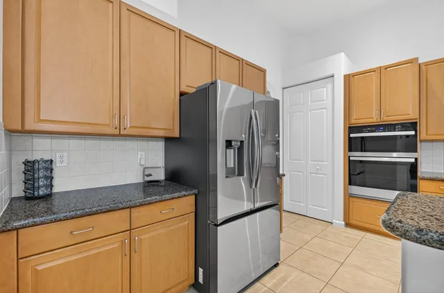 a kitchen with stainless steel appliances granite countertop a stove and a sink