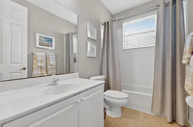 a bedroom with a bed couch and window