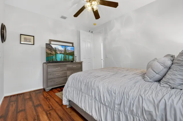 a bed sitting in a bedroom next to a window