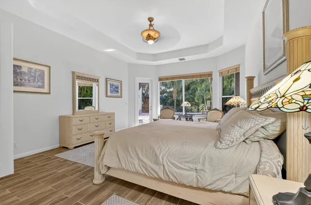 a large white kitchen with a large window