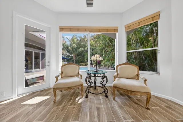a view of a swimming pool with a sitting space