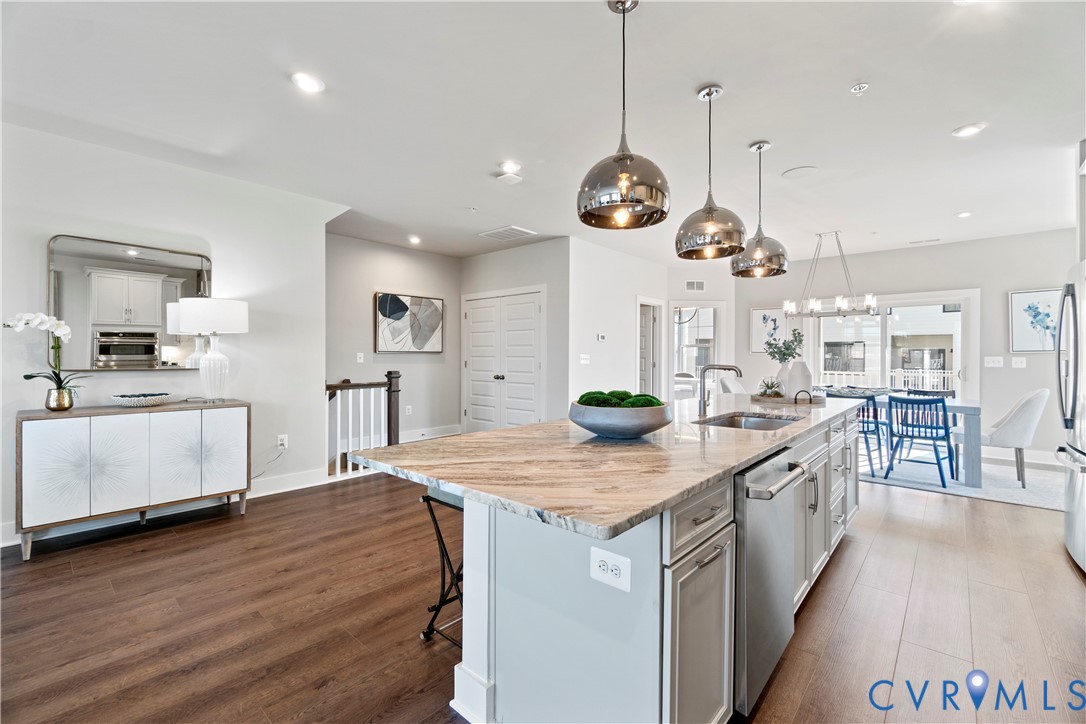3603 Edna Path, Unit B Henrico, VA 23233 - Photo 12 of 41 a large kitchen with stainless steel appliances kitchen island granite countertop a large island in the center