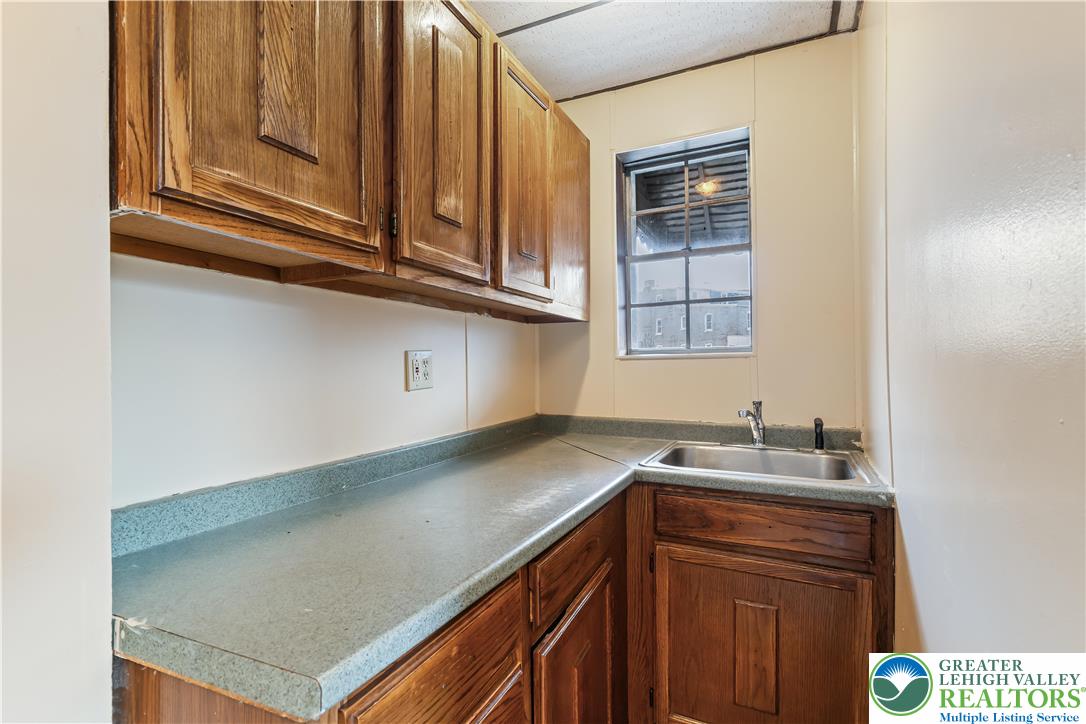 339 East Howe Street Allentown, PA 18109 - Photo 12 of 35 a kitchen with a sink and cabinets