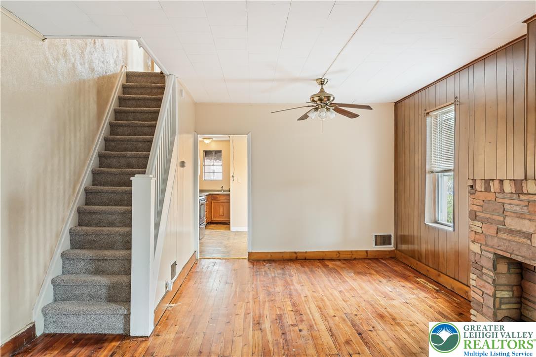 339 East Howe Street Allentown, PA 18109 - Photo 14 of 35 a view of a livingroom with wooden floor and stairs