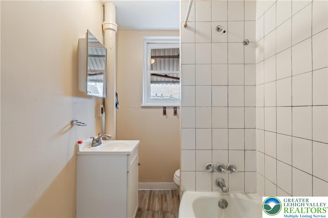 339 East Howe Street Allentown, PA 18109 - Photo 15 of 35 a bathroom with a sink and a mirror