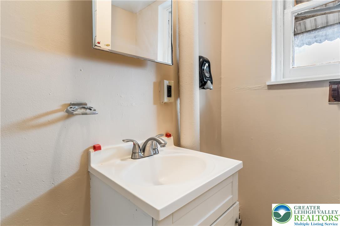 339 East Howe Street Allentown, PA 18109 - Photo 16 of 35 a bathroom with a sink and a mirror