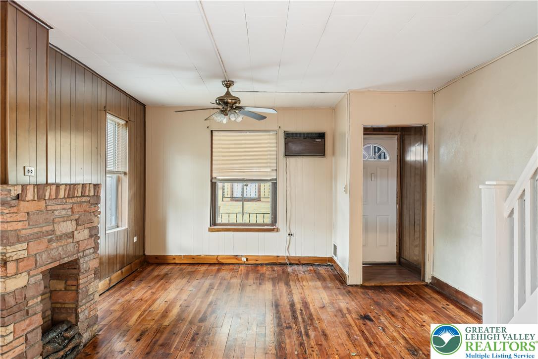 339 East Howe Street Allentown, PA 18109 - Photo 8 of 35 an empty room with wooden floor and windows