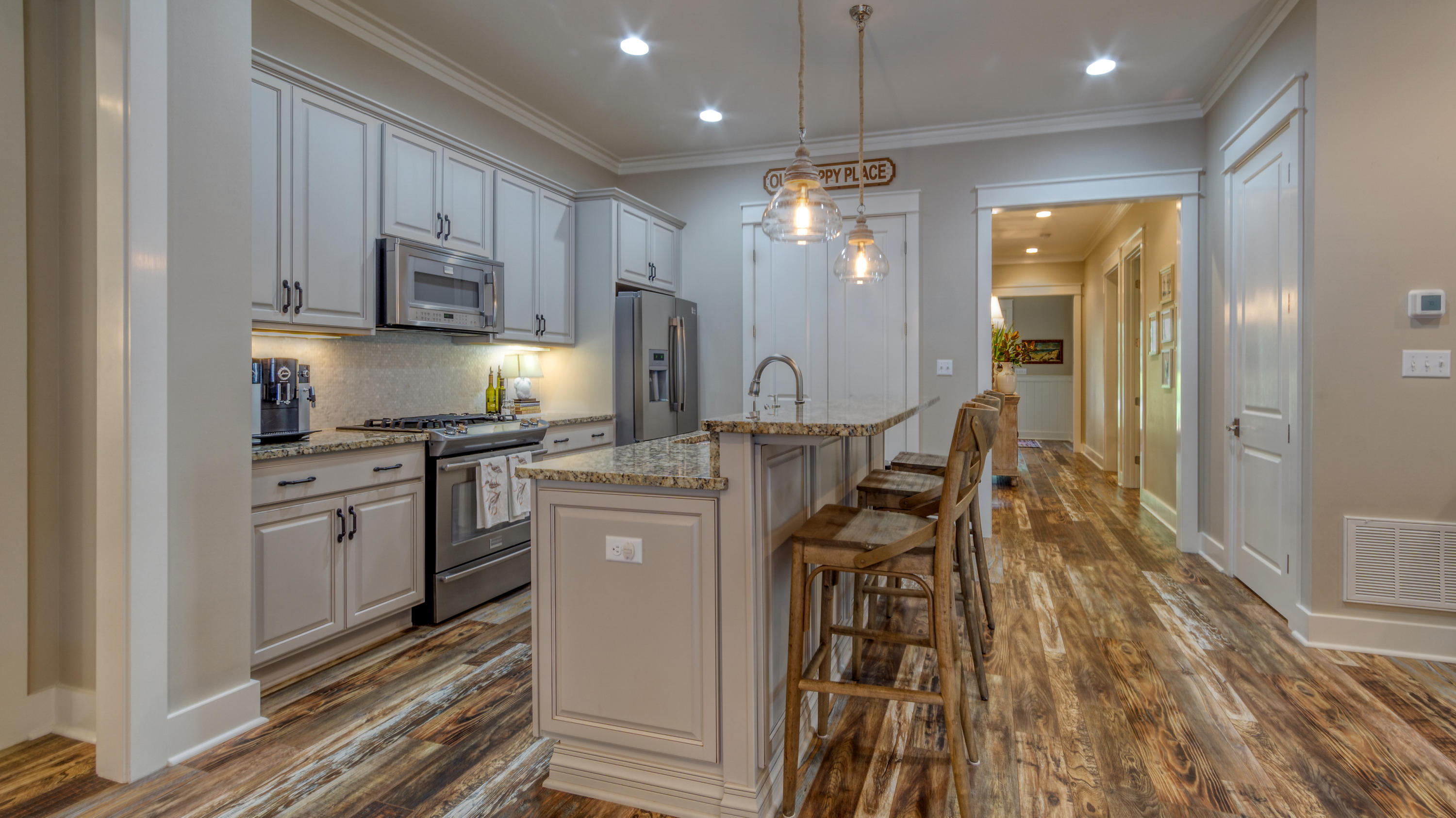 399 Medley Street Watersound, FL 32461 - Photo 23 of 30 a kitchen with kitchen island granite countertop a sink appliances cabinets and furniture