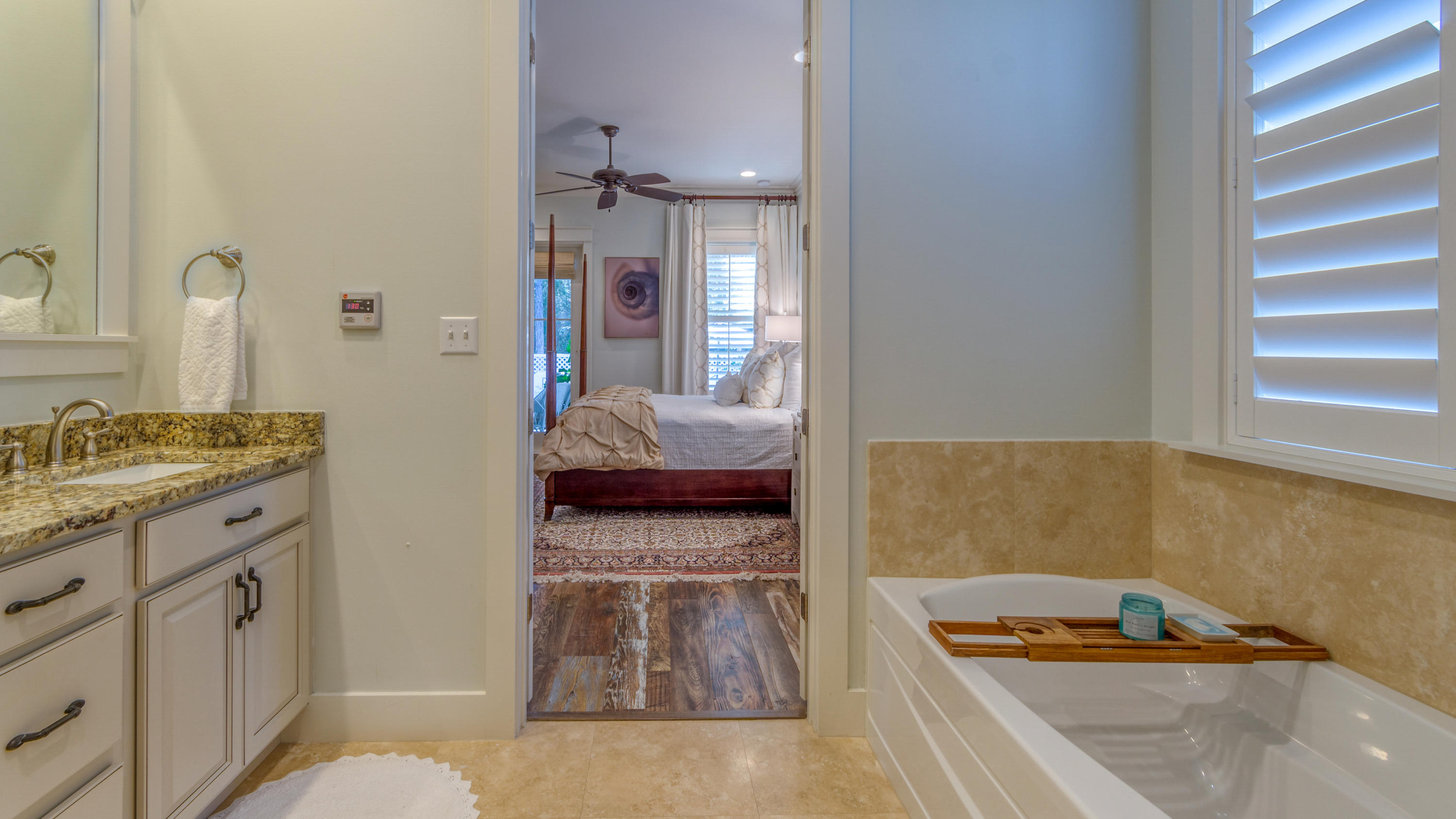 399 Medley Street Watersound, FL 32461 - Photo 26 of 30 a bathroom with a tub sink and mirror
