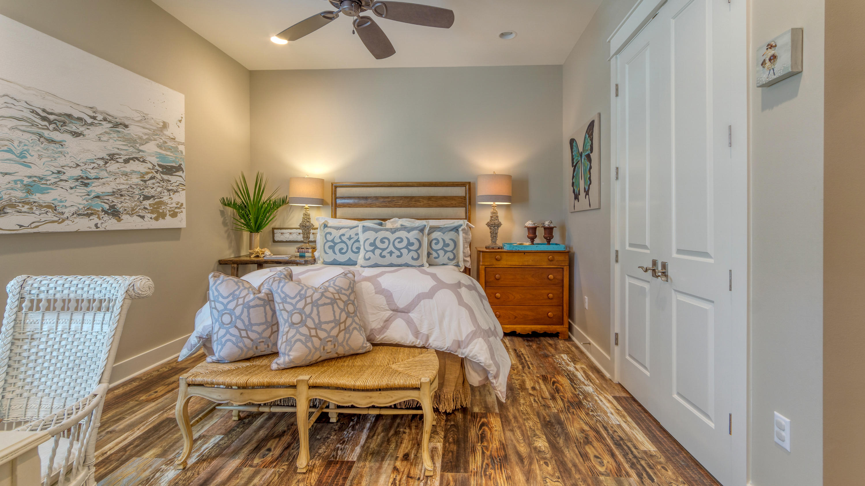 399 Medley Street Watersound, FL 32461 - Photo 8 of 30 a bedroom with a bed and a painting on the wall