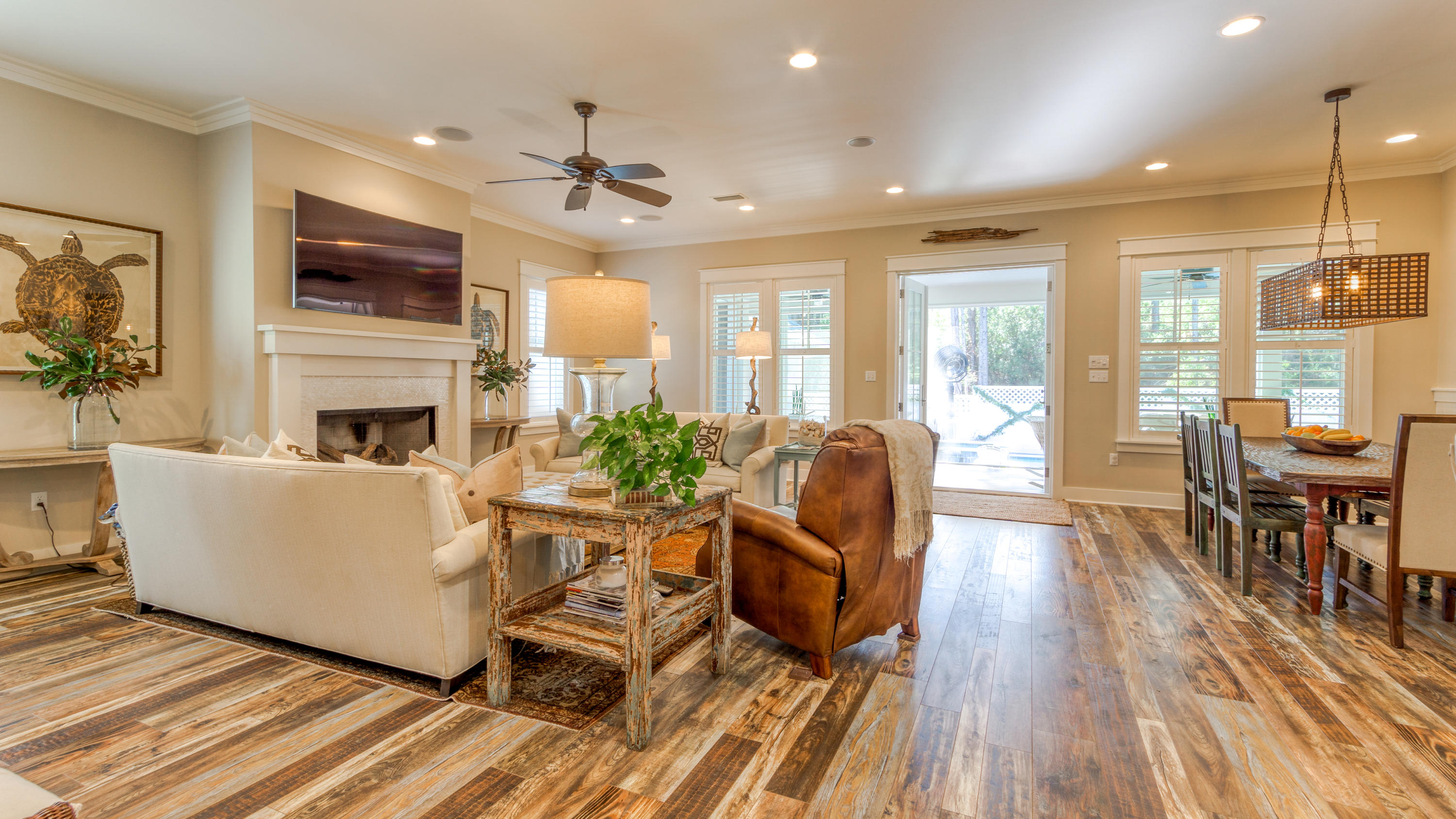 399 Medley Street Watersound, FL 32461 - Photo 9 of 30 a living room with furniture a flat screen tv and a fireplace