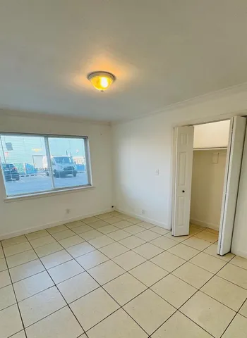 a view of an empty room and window