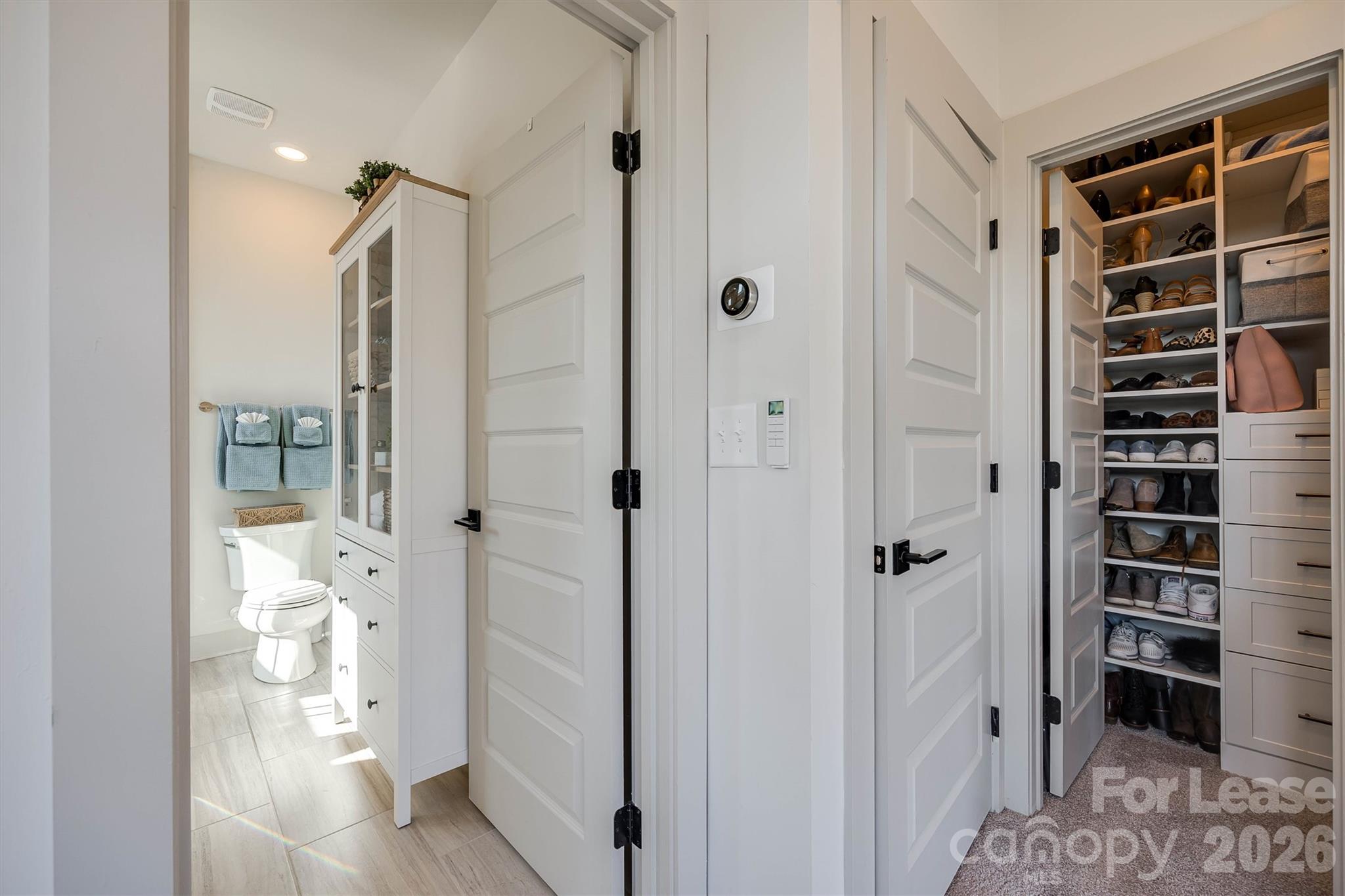 2319 Wesley Village Road Charlotte, NC 28208 - Photo 30 of 44 a view of a bathroom with a tub and shower
