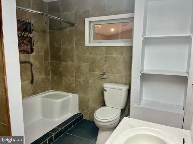 100 Errickson Avenue Moorestown, NJ 08057 - Photo 12 of 27 a white toilet sitting next to a bath tub