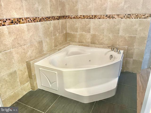 100 Errickson Avenue Moorestown, NJ 08057 - Photo 14 of 27 a white bath tub sitting in a bathroom