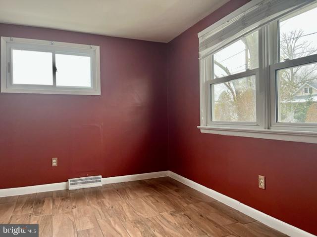 100 Errickson Avenue Moorestown, NJ 08057 - Photo 20 of 27 an empty room with wooden floor and windows