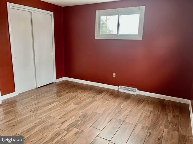 100 Errickson Avenue Moorestown, NJ 08057 - Photo 21 of 27 an empty room with wooden floor and windows