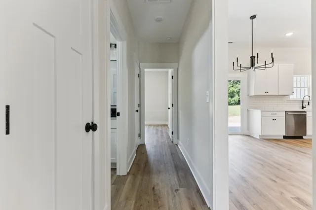 a view of a kitchen with wooden floor