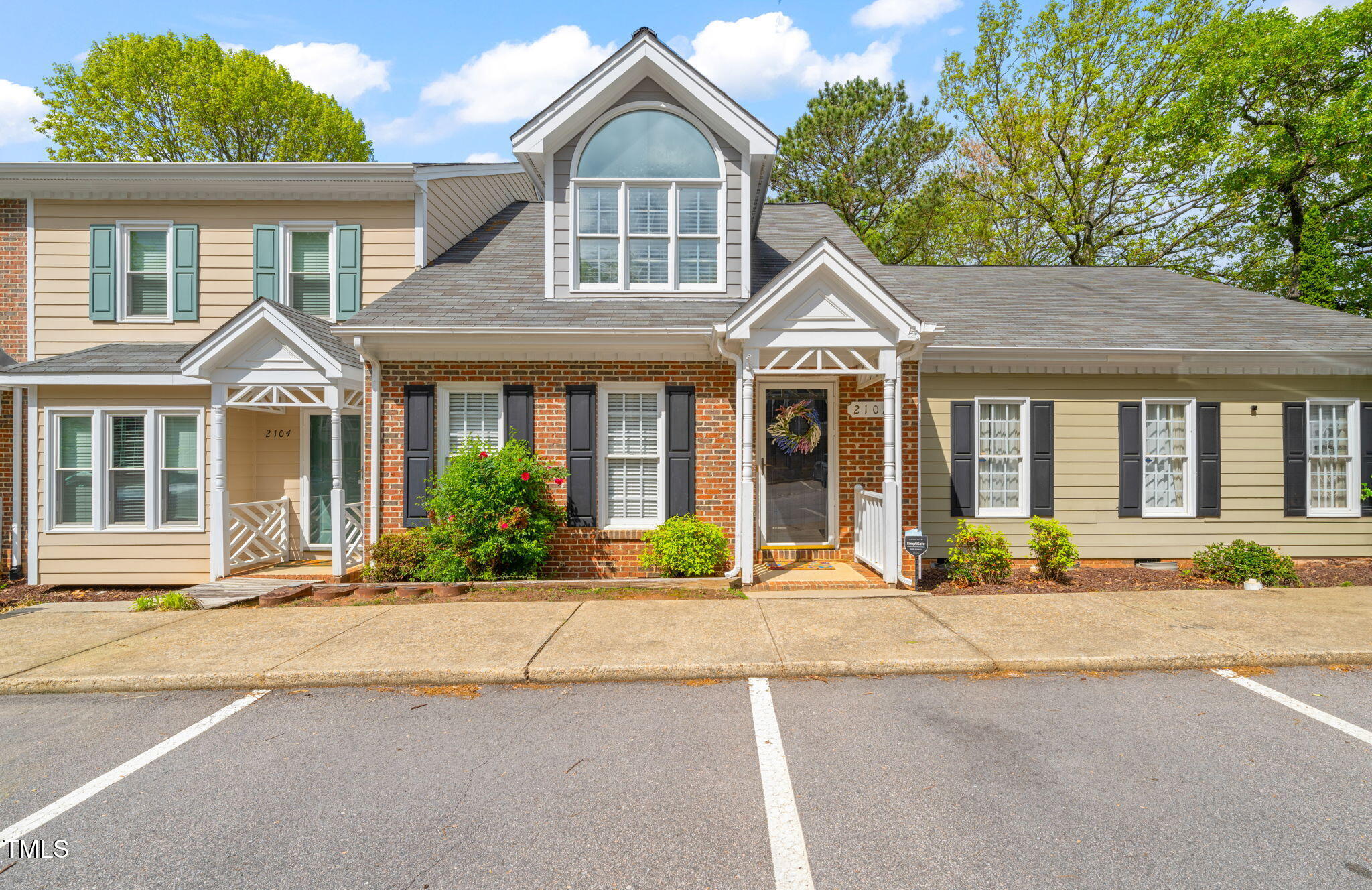 2102 Trailridge Court Raleigh, NC 27603 - Photo 1 of 28 a front view of a house with a yard and potted plants