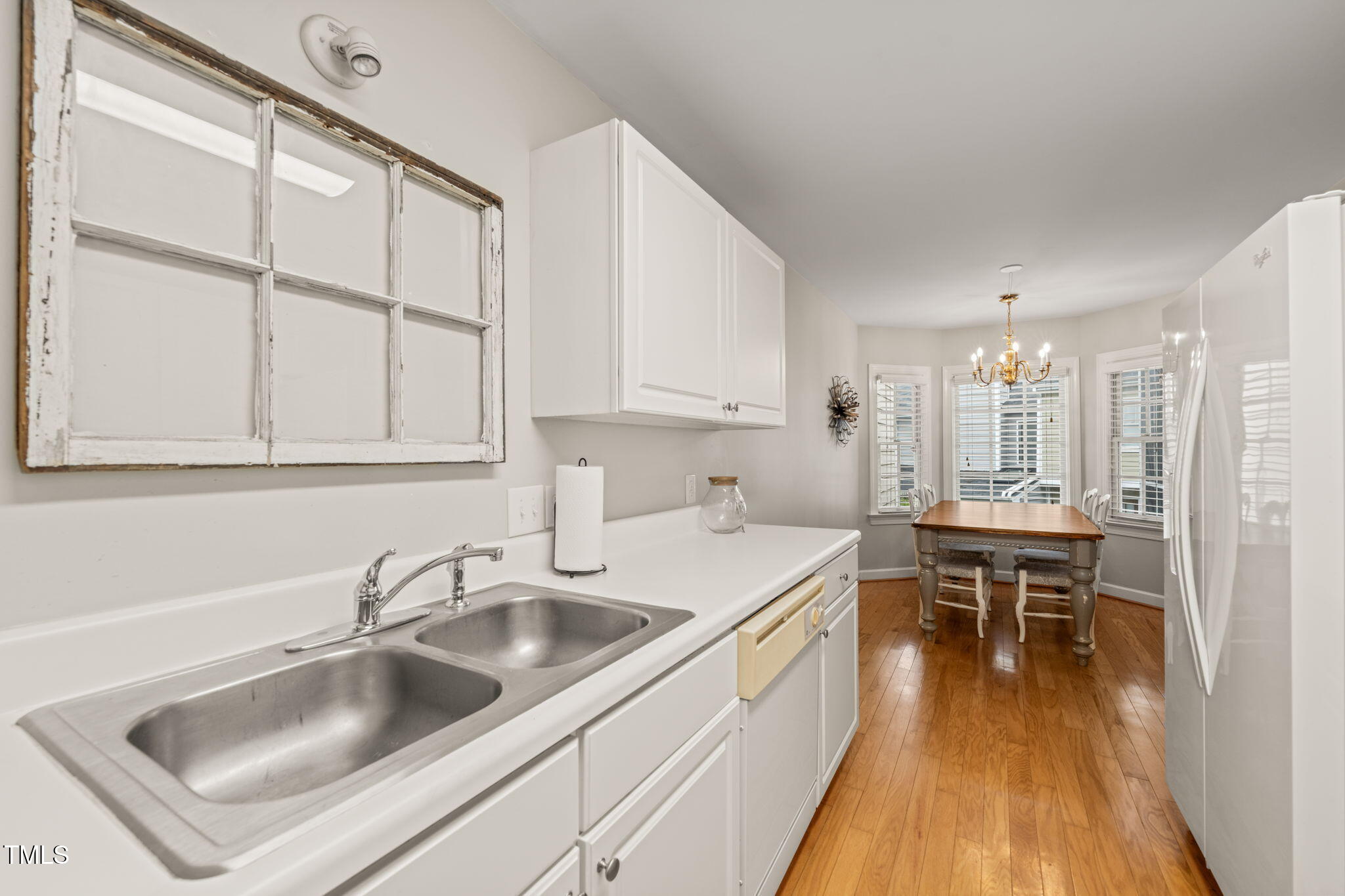 2102 Trailridge Court Raleigh, NC 27603 - Photo 17 of 28 a kitchen that has a sink and a table in it