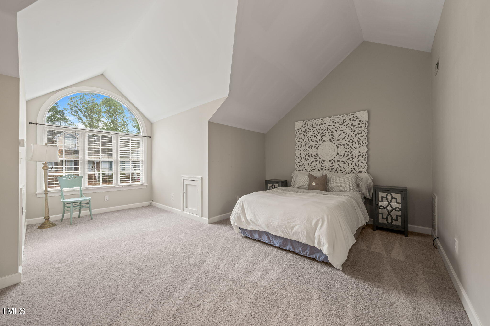 2102 Trailridge Court Raleigh, NC 27603 - Photo 19 of 28 a large bed sitting in a bedroom next to a large window