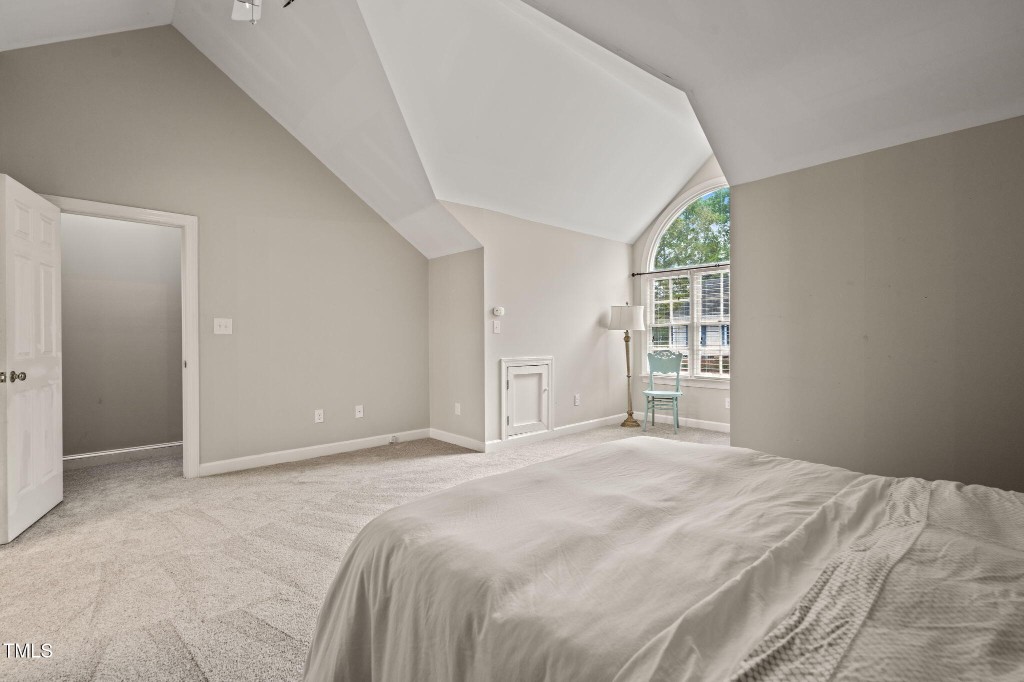 2102 Trailridge Court Raleigh, NC 27603 - Photo 21 of 28 a bedroom with a large bed and a window