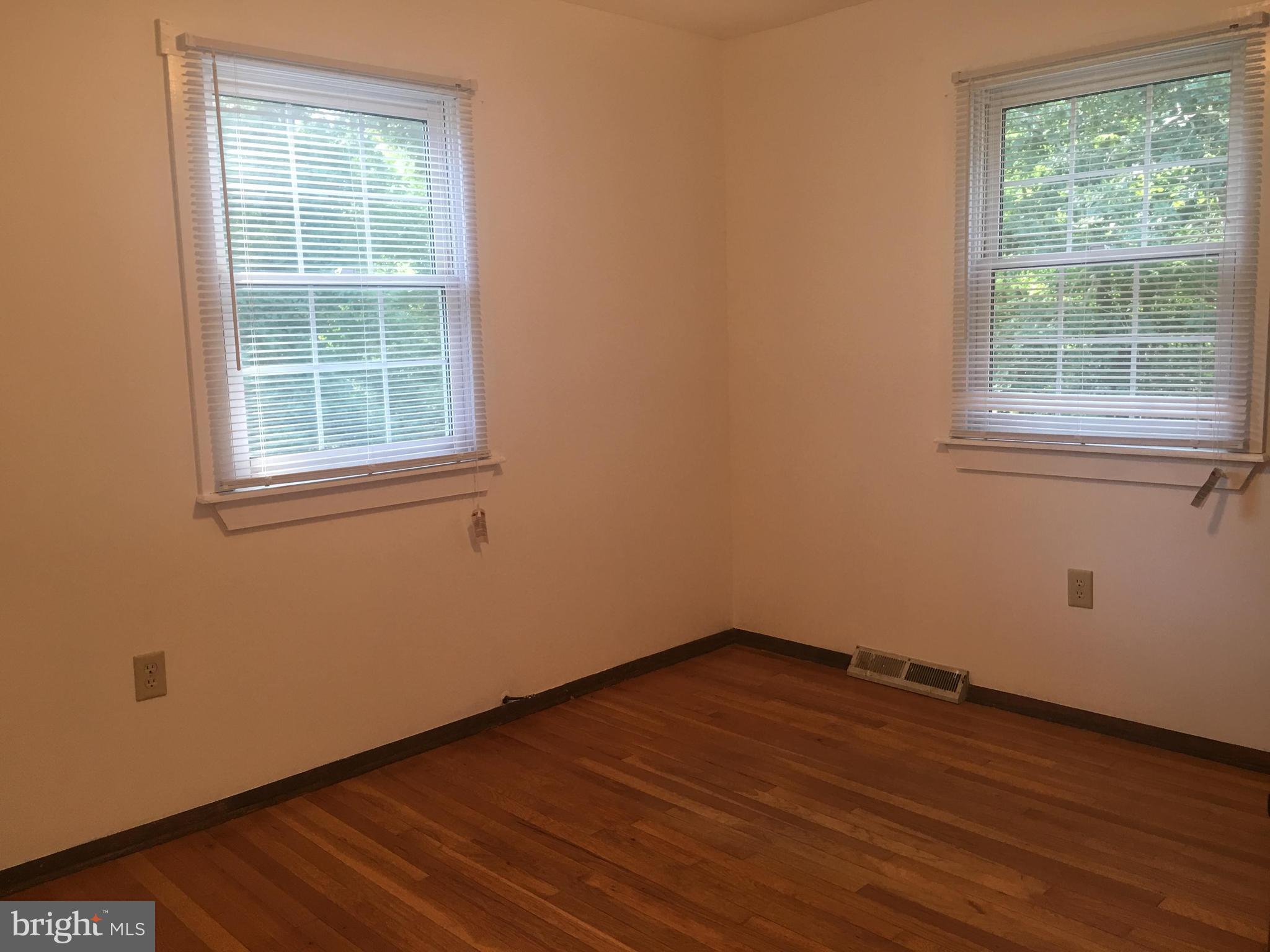 Bedroom with hardwood flooring