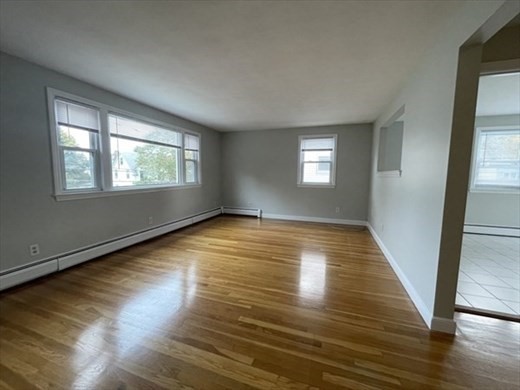 59 Desoto Road, Unit 2 Boston, MA 02132 - Photo 3 of 13 a view of empty room with wooden floor and fan