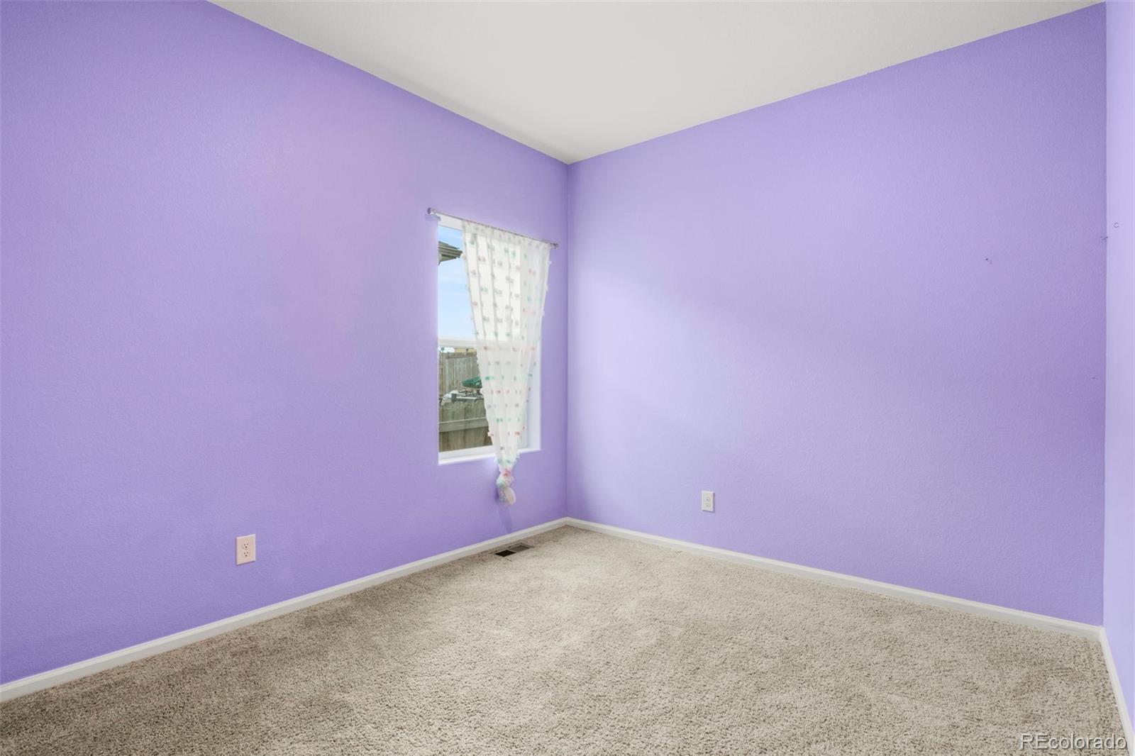 311 Maple Street Bennett, CO 80102 - Photo 29 of 35 an empty room with a window