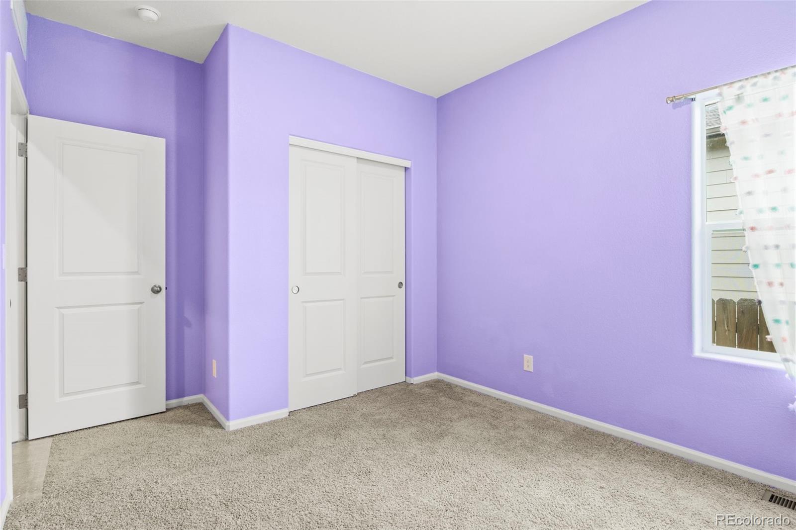 311 Maple Street Bennett, CO 80102 - Photo 30 of 35 an empty room with windows
