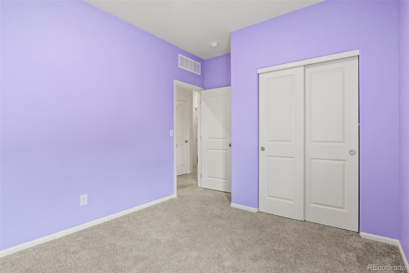 311 Maple Street Bennett, CO 80102 - Photo 31 of 35 an empty room with a door