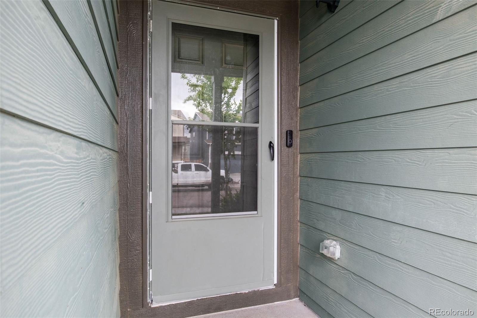 311 Maple Street Bennett, CO 80102 - Photo 5 of 35 a view of a door and a window