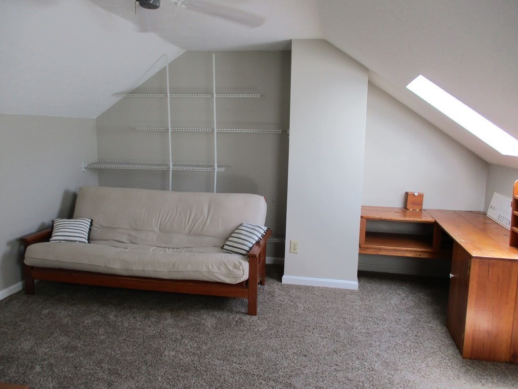 2 Tuck Farm Road, Unit 5 Auburn, MA 01501 - Photo 11 of 11 a bedroom with furniture and a ceiling fan